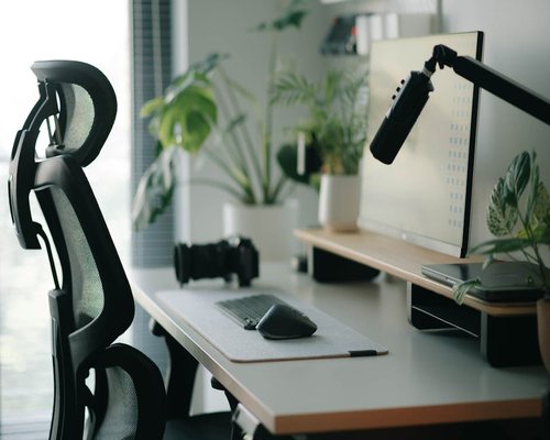 ergonomic office chair and standing desk setup